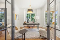 home office with floating desk and seating area