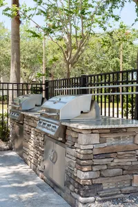 outdoor kitchen around pool