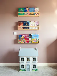 farrow-and-ball-sulking-room-pink-book-shelves-and-dollhouse