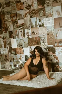 Woman in black lingerie sits on a white rug beside a disco ball, surrounded by a vintage photo collage, creating a warm, glamorous mood.