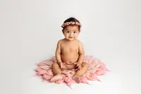 baby sitting on textured blanket during luxury milestone photography session in North Hollywood