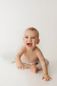 smiling baby during studio milestone portrait session in Burbank