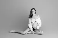 Rosalyn cradling bump during artistic maternity photography in Hollywood