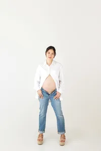 mother-to-be in neutral tones posing during timeless studio maternity session in Burbank