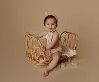 baby sitting with props during luxury milestone portrait session at CG Photography