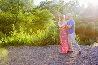 couple holding each other during outdoor maternity portrait session in Los Angeles