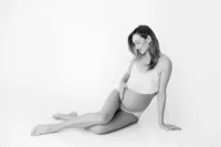 Rosalyn cradling bump during artistic maternity photography in North Hollywood