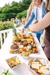 Grazing board being styled for cocktail hour