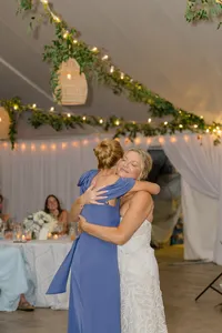 Bride hugging a guest on the dance floor