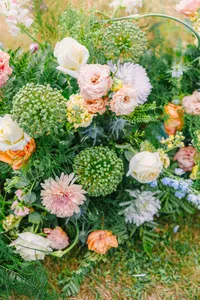 Lush garden florals in soft peach and green