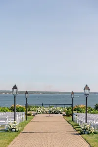 Lantern lined aisle leading to the water