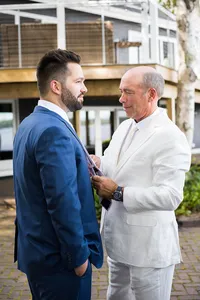 Groom sharing a moment with a loved one before the ceremony