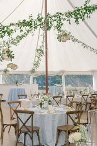 Round tables set beneath hanging greenery