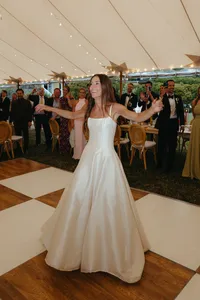 Bride dancing on a checkered dance floor