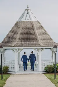 Grooms walking toward the gazebo at French's Point