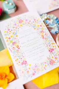 Watercolor floral wedding stationery with bright citrus details