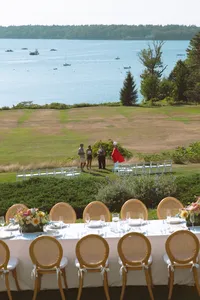 Reception tables on the lawn overlooking the water