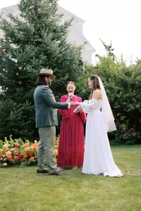 Couple exchanging vows in a garden ceremony