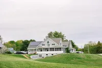 Penobscot Bay Estate main house above a green lawn