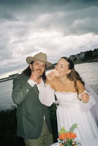Couple laughing together by the water