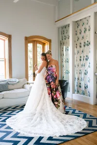 Bride in her gown with her mother as she gets ready for her Samoset Resort wedding in Rockport, Maine