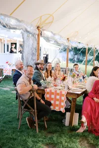 Guests at dinner under the sailcloth tent