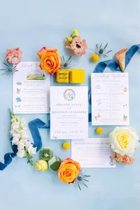 Pastel invitation suite with ring box and fresh blooms
