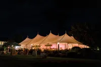 Sailcloth reception tent glowing at night at the Samoset Resort in Rockport, Maine