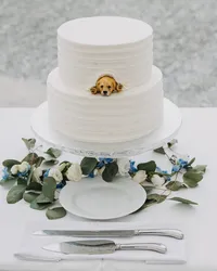 White wedding cake decorated with fresh flowers