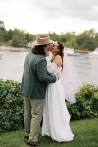Couple sharing a kiss by the water