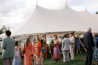 Guests gathering outside the sailcloth tent