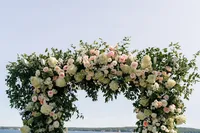 Garden floral ceremony arch overlooking the water at the Samoset Resort