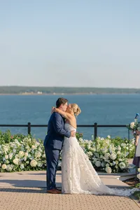 Couple kissing on the terrace overlooking Penobscot Bay