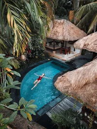 Luxury private pool surrounded by lush greenery, perfect for a secluded boutique travel experience.