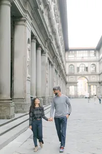 Engagement session in Florence – romantic couple walking near Uffizi Gallery, Italy wedding photographer capturing timeless love.