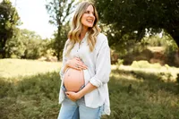 an expecting mom shows off her growing bump during her maternity session in abilene,texas