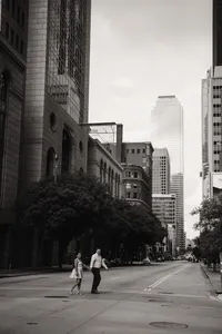 a newly engaged couple walks the streets of downtown dallas
