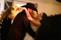 a bride and groom dance during their wedding reception