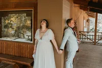Bride and groom holding hands during their first touch at their wedding venue at Deer Creek Mountain Camp