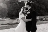 bear hug during wedding couple pictures