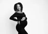pregnant-black-woman-in-black-dress