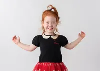 smiling-redhead-girl-school-picture
