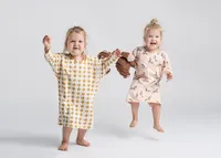 twins-jumping-up-in-the-air-in-chicago-studio