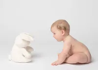 baby-sitting-looking-at-stuffed-bunny