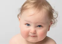 closeup-photo-of-baby-with-blue-eyes