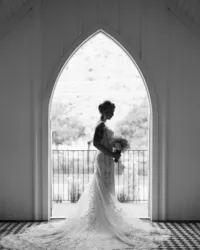 An editorial-style silhouette bridal portrait taken at All Saints Chapel in downtown Raleigh, captured by North Carolina wedding photographer Jessica Leigh Mason.