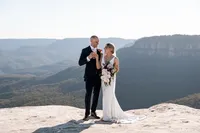 Bride and groom going for a cheers