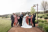 The groom and bride celebrating with their bridal party