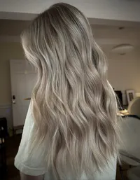 beachy waves on long blonde hair with beautiful ribbons bright blonde at Moxie Hair Studio