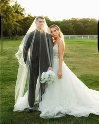 long veil covering man and wife